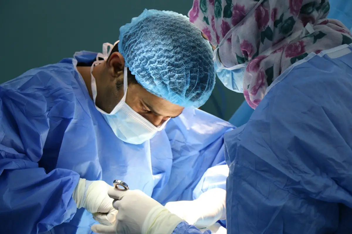 Surgeon performing an operation in a modern operating theatre